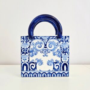 Hand-painted chinoiserie blue and white ceramic purse vase in new motif