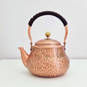 Front view of copper tea kettle for stovetop